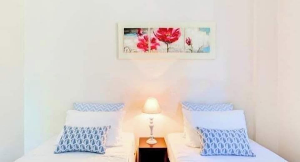 A bright and welcoming bedroom designed for restful nights after a day of exploring Crete.