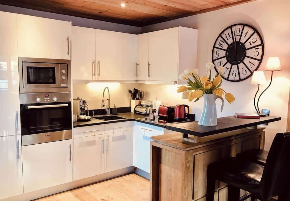 The well equipped kitchen at apartment One Le Savoy 