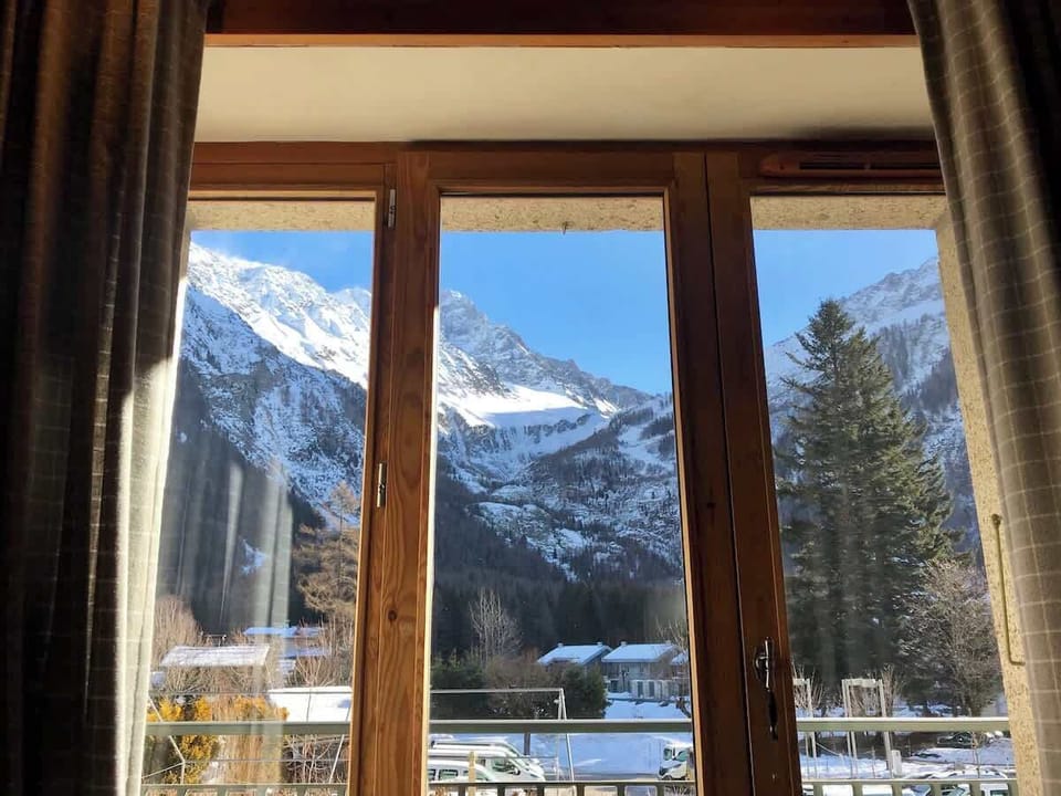 The picture frame view from the dining table out onto the balcony and enticing alps. 