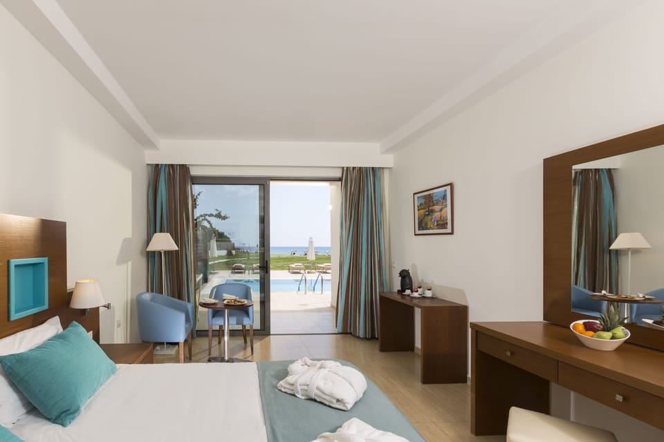 Junior Studio Suite, Sea View (Sharing pool) | In-room safe, desk, free WiFi, bed sheets