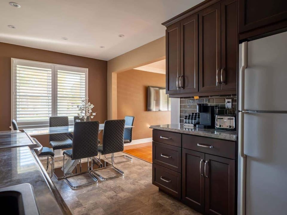 Enjoy meals together with seating for six at our inviting dining table in the heart of the kitchen.