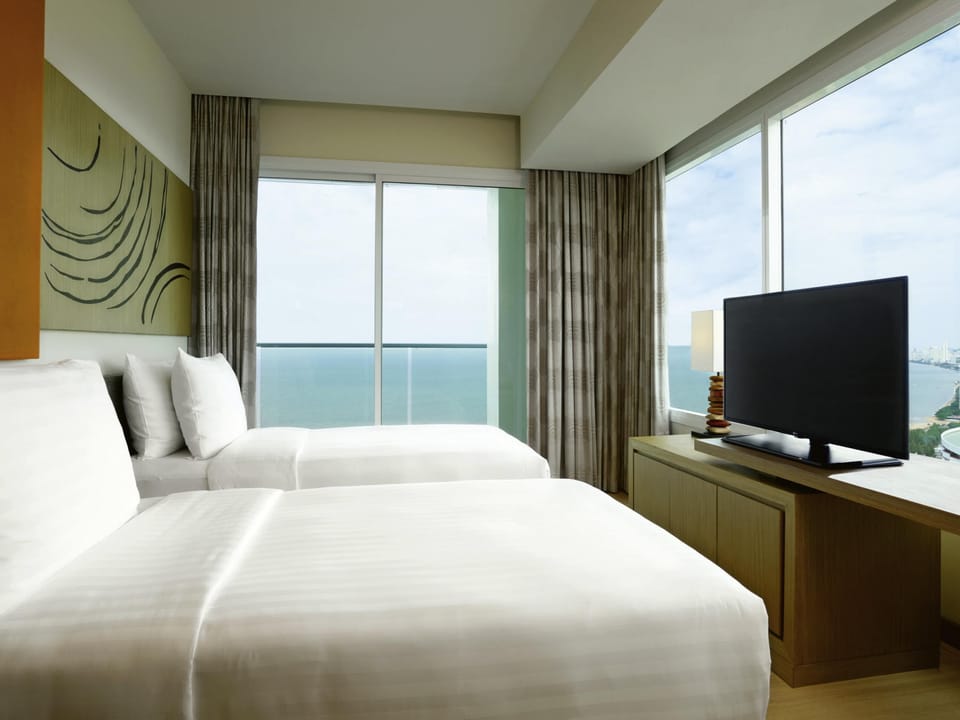 Family Suite, Multiple Beds, Sea View | Egyptian cotton sheets, premium bedding, minibar, in-room safe
