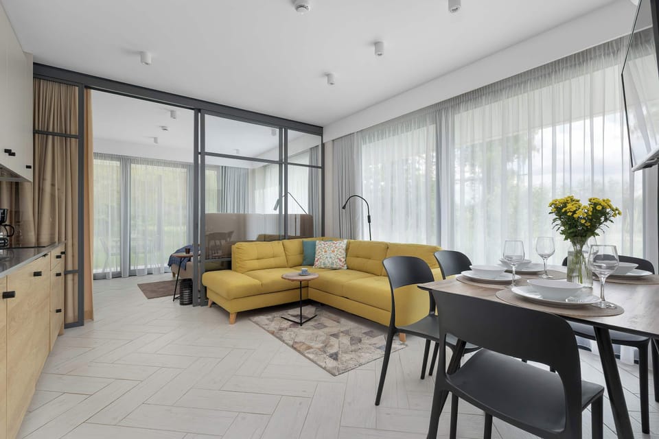 The living room has a modern look and comfortable furniture.
