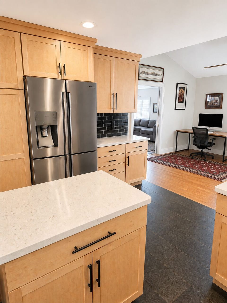 A dedicated workspace just off the kitchen makes it easy to stay connected.