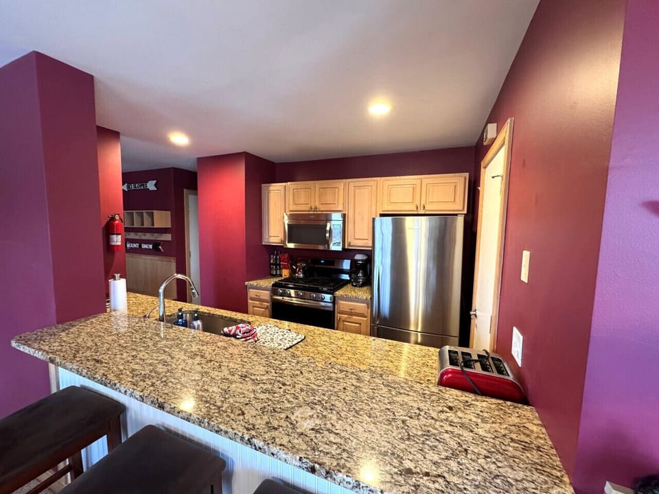 Fully equipped kitchen with SS appliances- Island seating