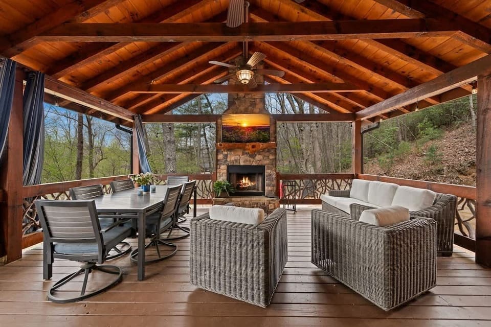 Deck includes outdoor ping pong table, fireplace, wall-mounted TV, dining table and area, sofa and chairs, propane grill (propane supplied via in-ground tank)