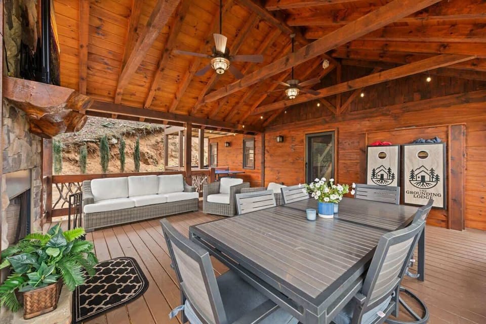 Deck includes outdoor ping pong table, fireplace, wall-mounted TV, dining table and area, sofa and chairs, propane grill (propane supplied via in-ground tank)