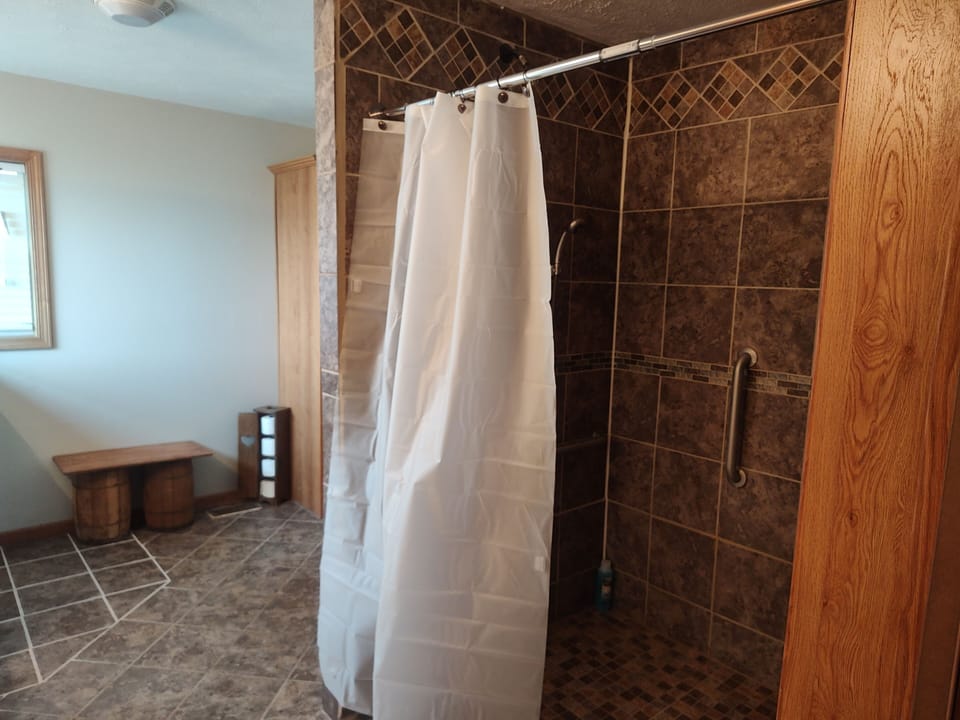shower, indoor, bathroom shower, bathroom amenities, roll in shower