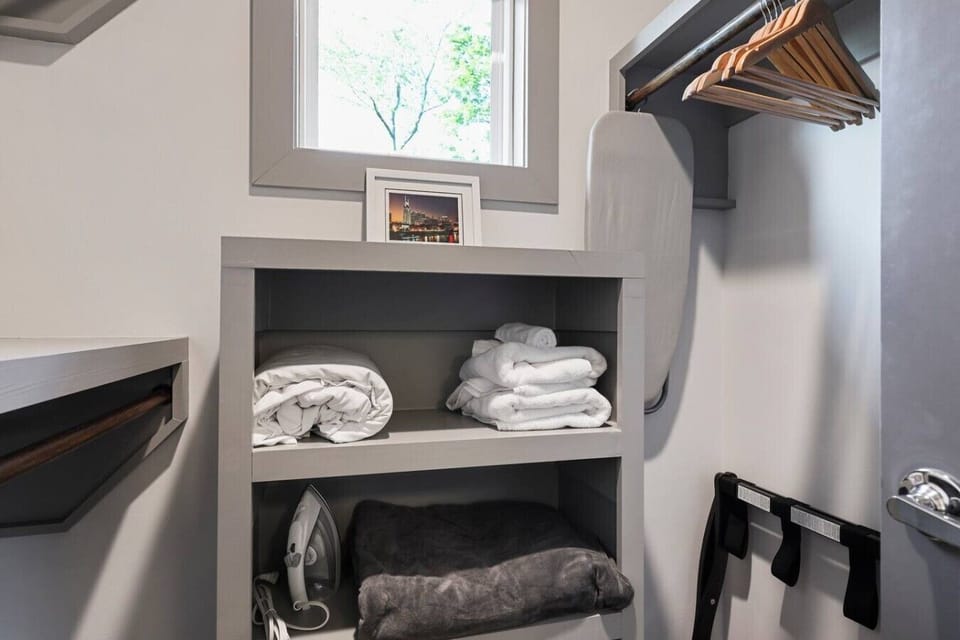 Closet space featuring extra bedding and towels ready for your stay.
