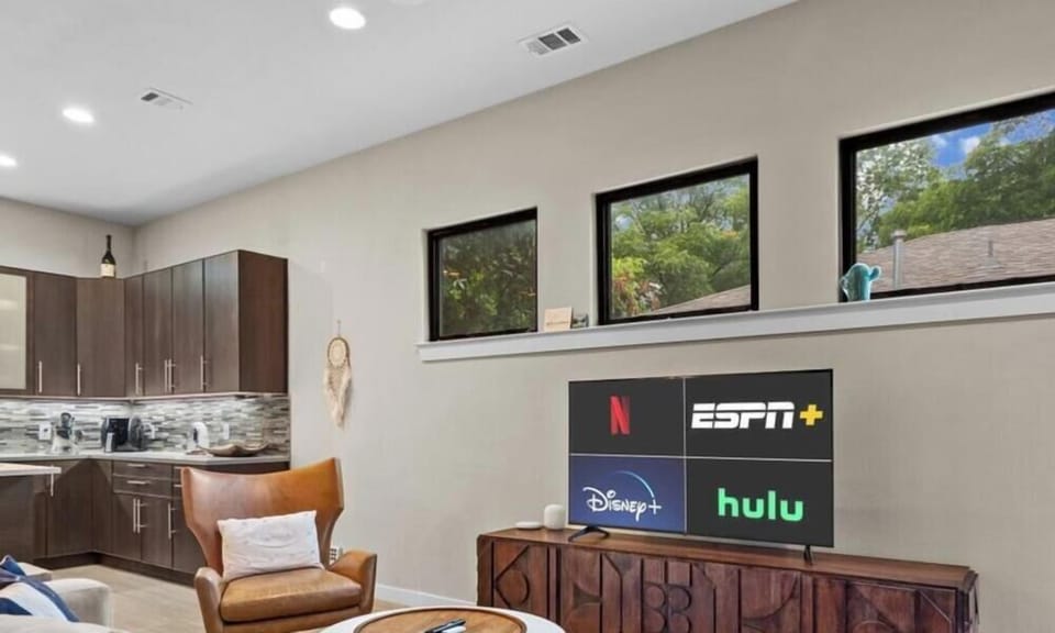 Stream your favorite shows on the large smart TV from the comfy sectional and leather lounge chair.