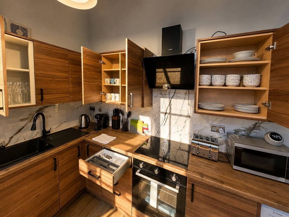 Fully equipped modern kitchen with everything needed for cooking, dining, and longer stays.