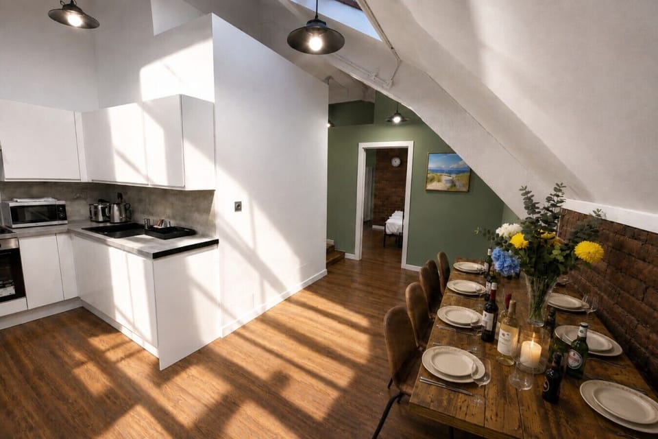 Fully equipped kitchen and dining area with plenty of seating — ideal for cooking, dining and spending time together during your stay