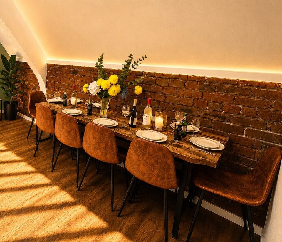 Stylish dining area with seating for the whole group — perfect for enjoying meals, drinks and quality time together during your Liverpool stay.