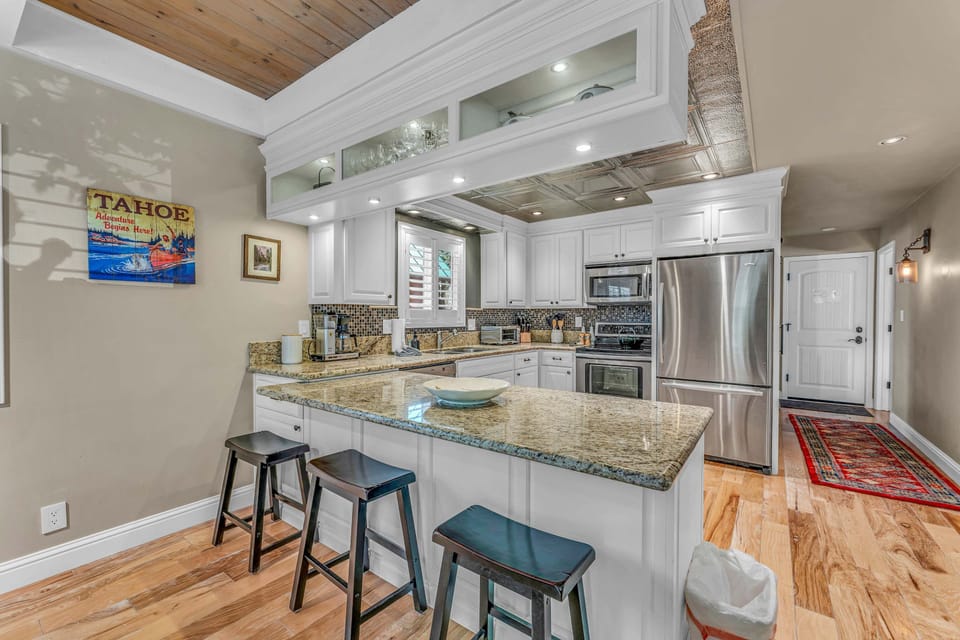 Kitchen: Drip coffee maker, tableware, cooking utensils
