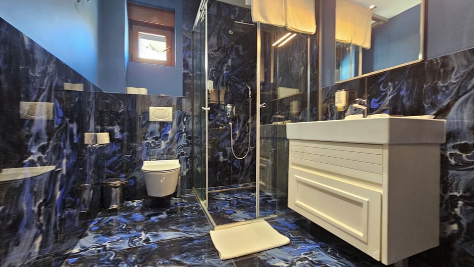 Luxury Suite, Balcony, Sea View | Bathroom | Free toiletries, slippers, soap, shampoo