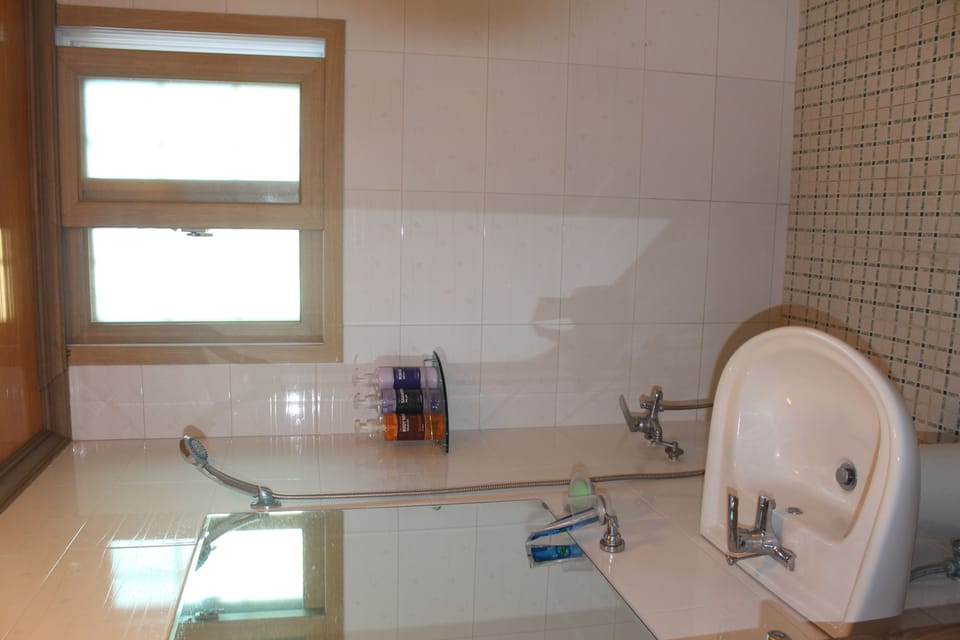 Room, 2 Bedrooms | Bathroom | Shower, free toiletries, hair dryer