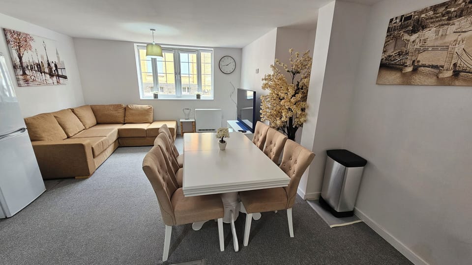 Bright open-plan lounge and dining area with seating for six