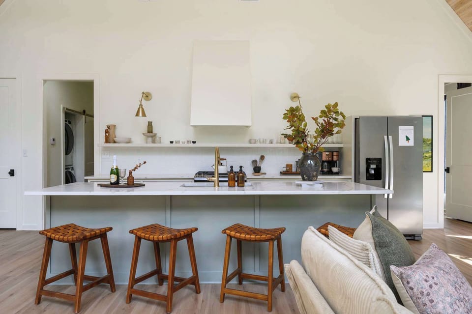  Pull up a stool and settle in — the spacious kitchen counter is perfect for morning coffee or evening drinks with your crew.