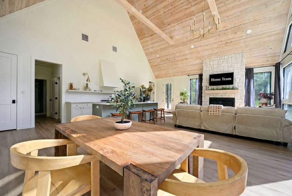  Soaring vaulted ceilings, a cozy fireplace, and an open layout — this grand living space is made for relaxing together in style.