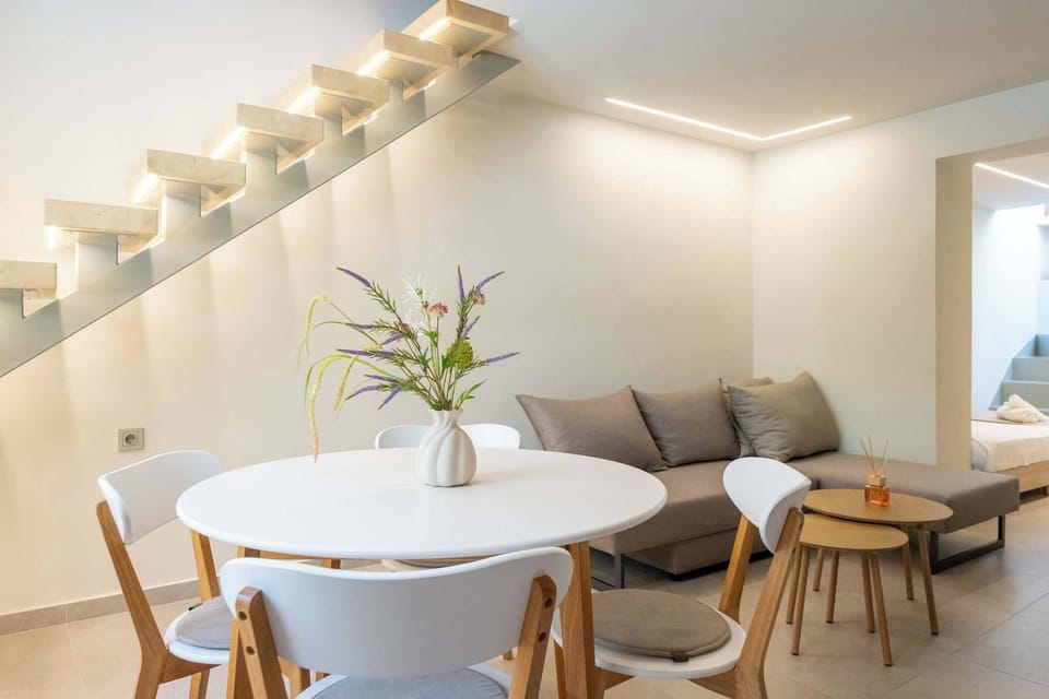Gather around the dining table in this bright and welcoming living space.