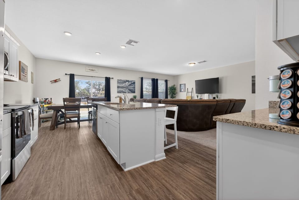 Open-concept kitchen, dining and living area perfect for gathering