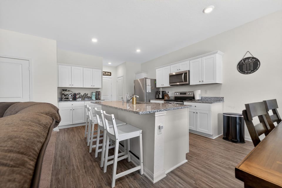 Fully equipped kitchen with large island seating and open-concept layout