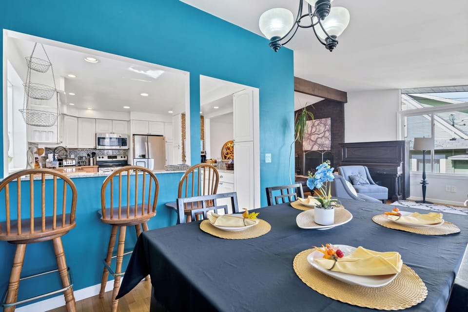 Bright open dining space with breakfast bar and easy kitchen access