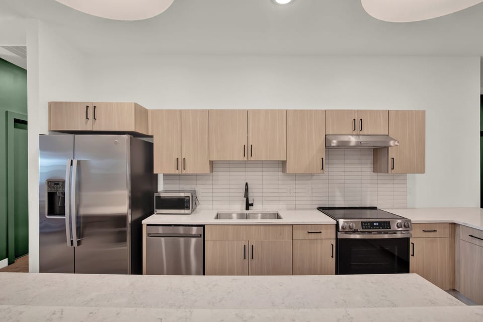 Modern kitchen with stainless appliances and spacious island