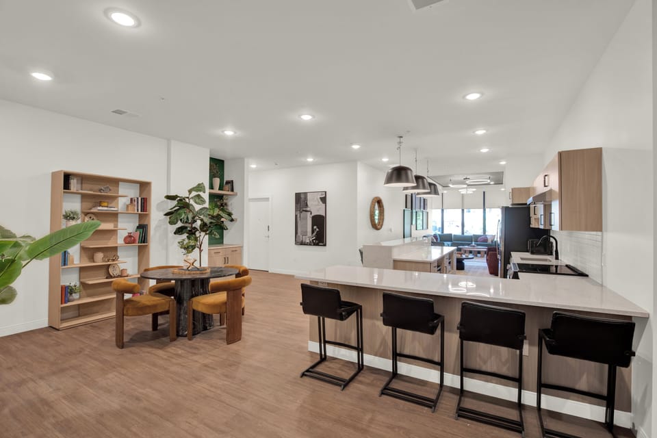 Bright open-concept kitchen and dining space with oversized island seating