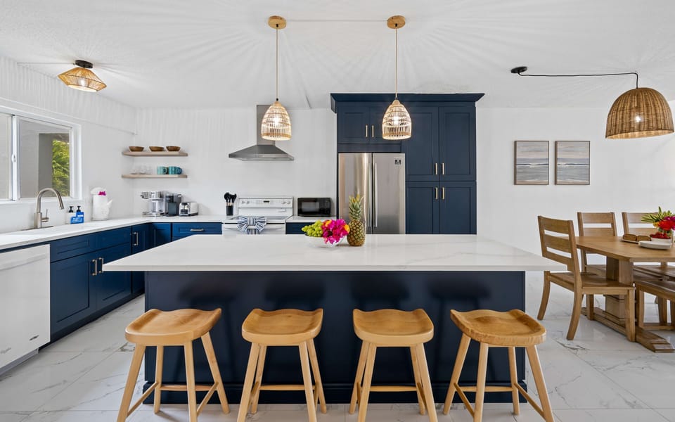 The spacious kitchen opens seamlessly into the dining and living areas.