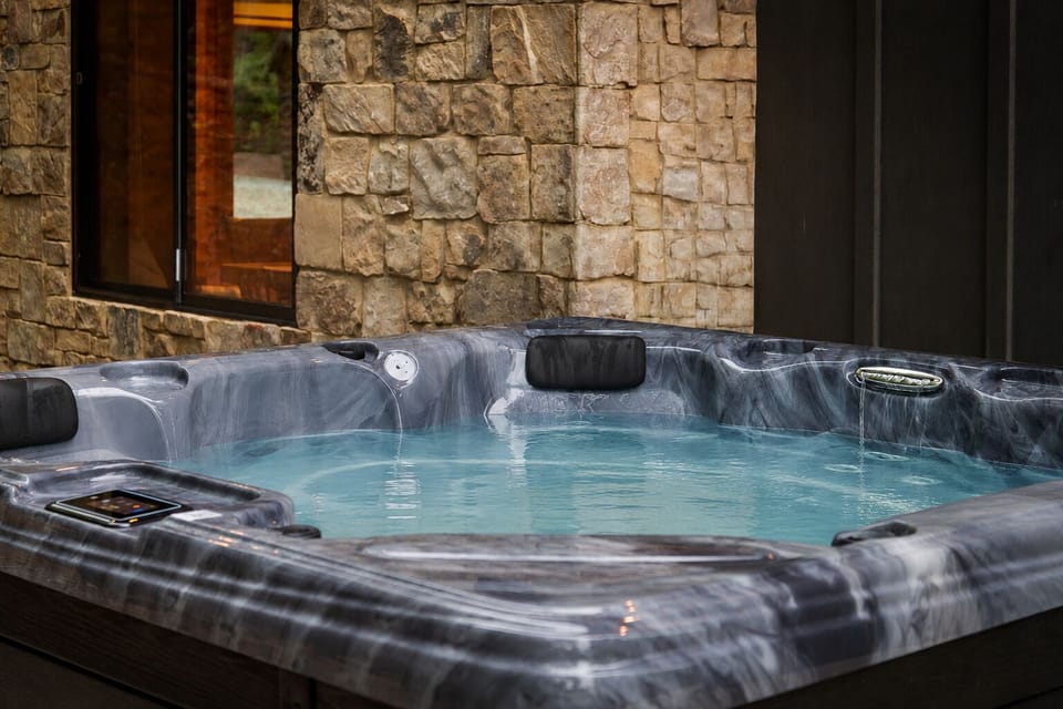 Sink into warm bubbling water as the forest settles into evening around you. This is the kind of hot tub retreat that turns a weekend away into pure restoration.
