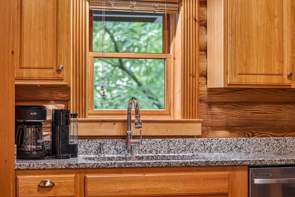 Fully stocked kitchen with stainless steel appliances and 4 person dining table