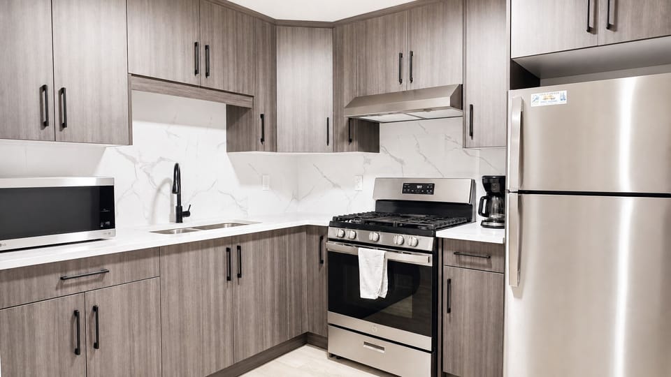 Modern kitchen with stainless appliances and stylish finishes