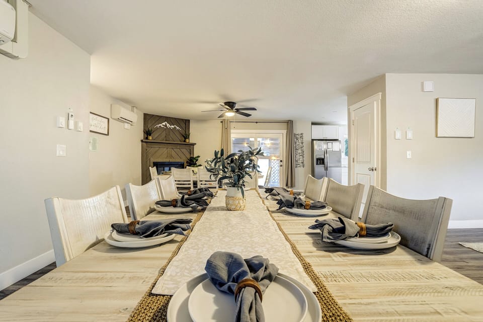 The dining area is designed for large groups with two dining tables that comfortably seat 16 guests