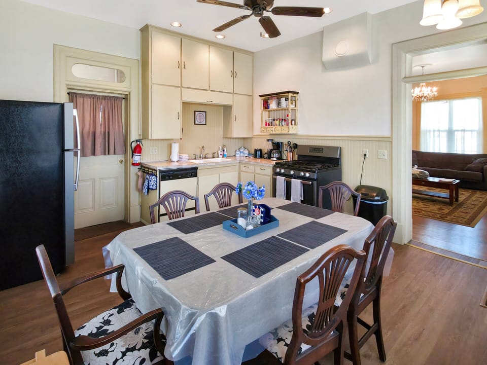 Kitchen flows into dining area.