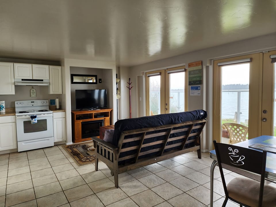 Condo | Living area | 32-inch flat-screen TV with cable channels, TV