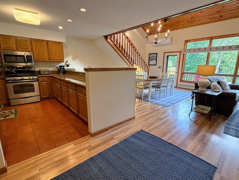 Main level kitchen offers granite countertops and stainless steel appliances.