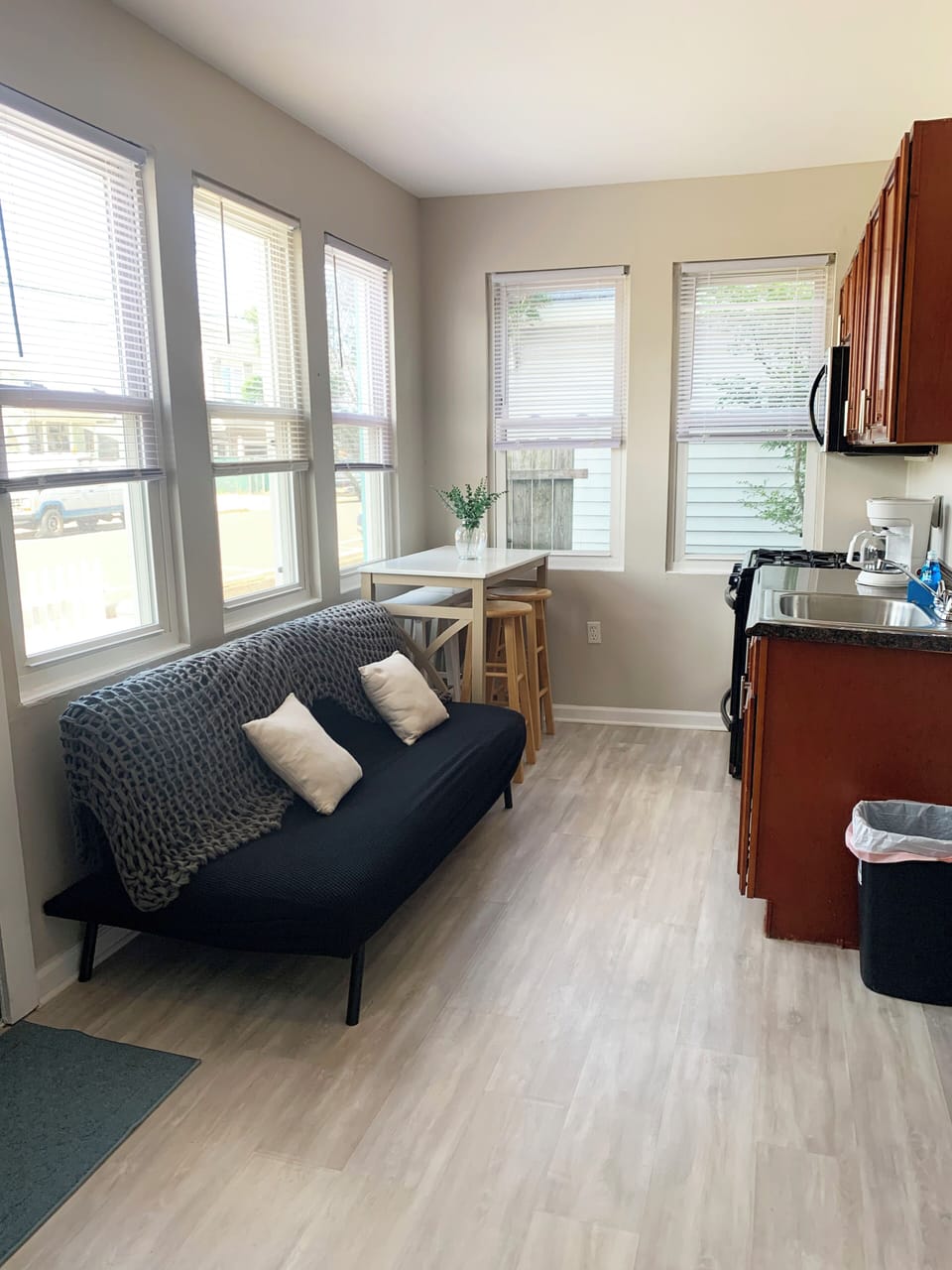 Bright, airy studio with full kitchen, dining nook, and cozy seating