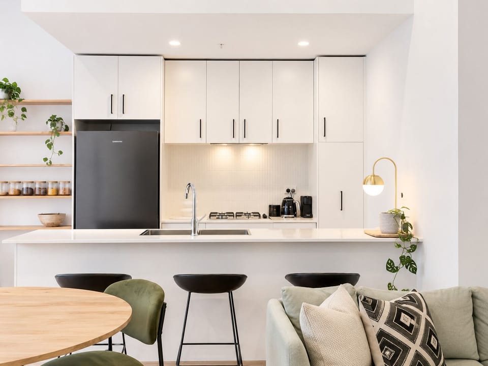 Bright modern kitchen with island seating and stylish open-plan design