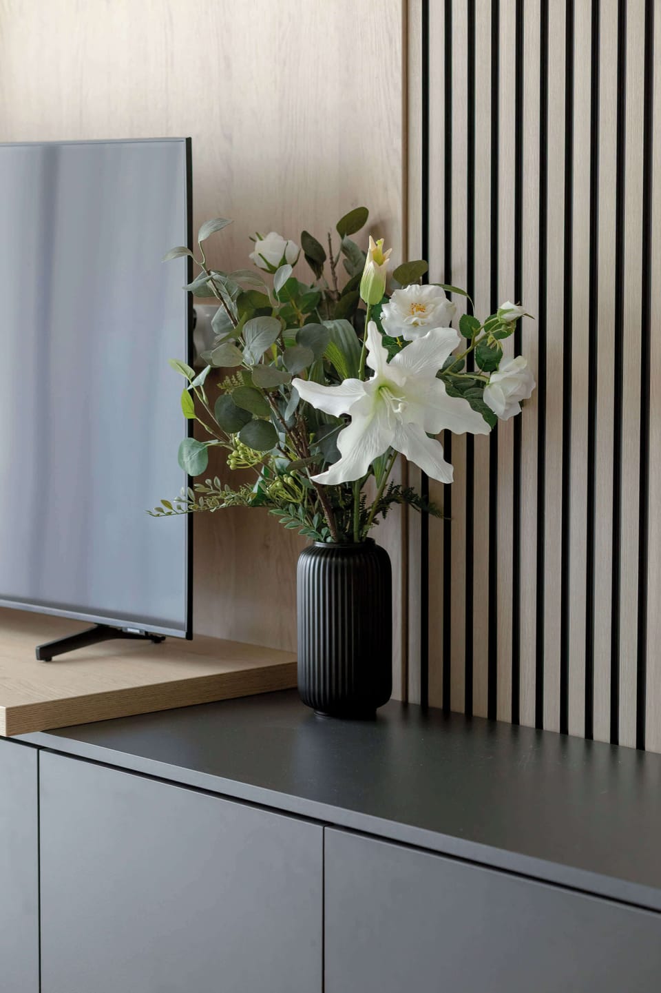 Decorative floral arrangement adding a welcoming touch to the apartment's interior.