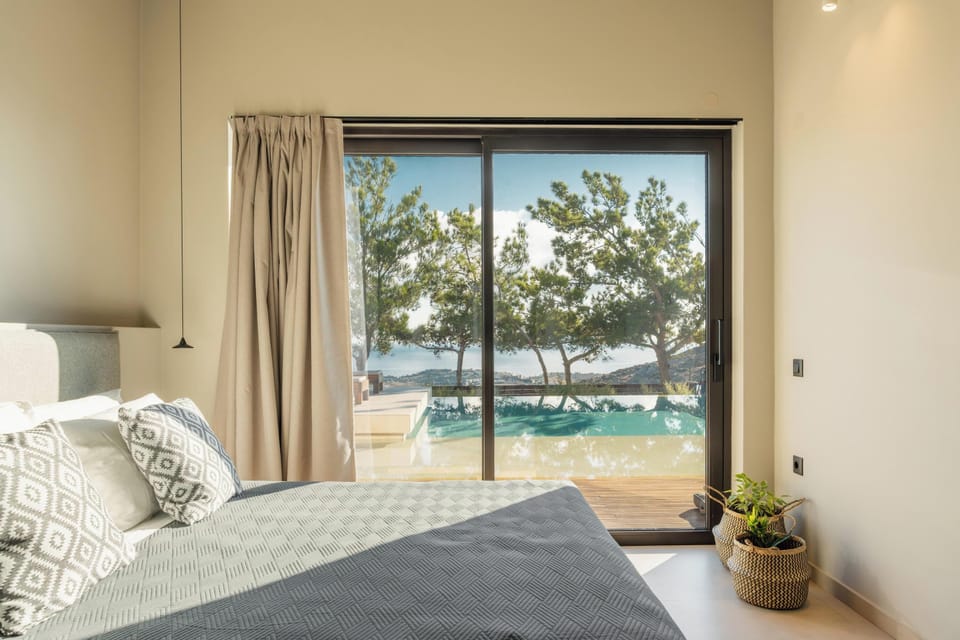 This room also features an open closet with a vanity and mirror, a self-controlled A/C, and direct access to the pool area.