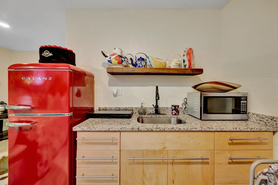 Kitchenette with retro fridge and granite countertops