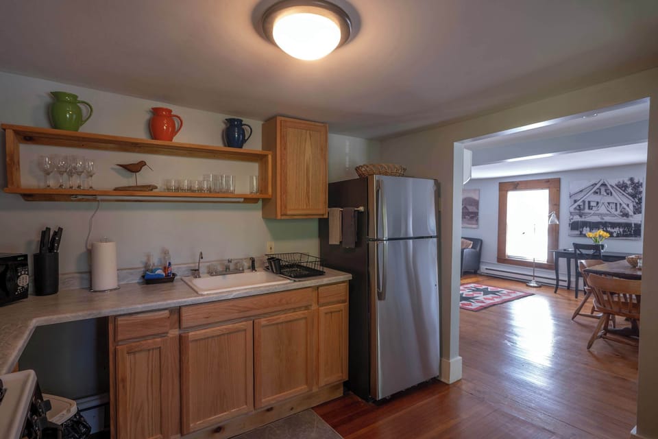 Full kitchen with stainless steel refrigerator