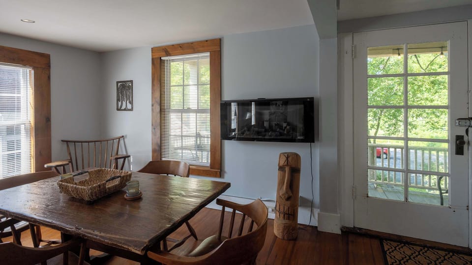 Dining room beside oversized windows