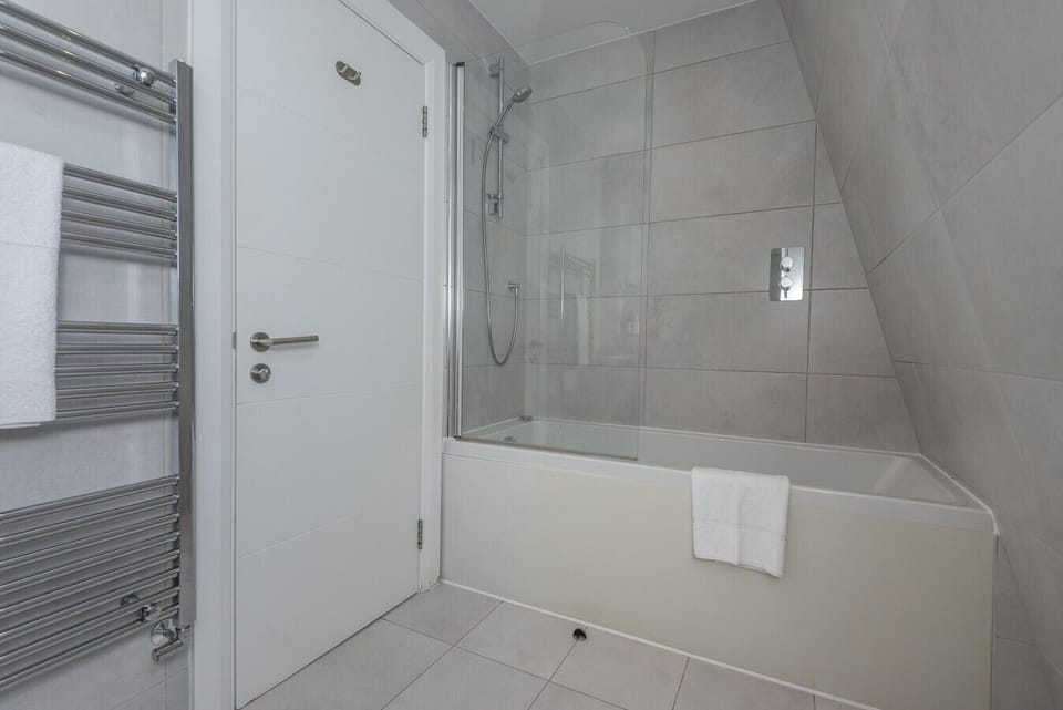 Fresh towels and a spacious bathroom help make mornings easy.