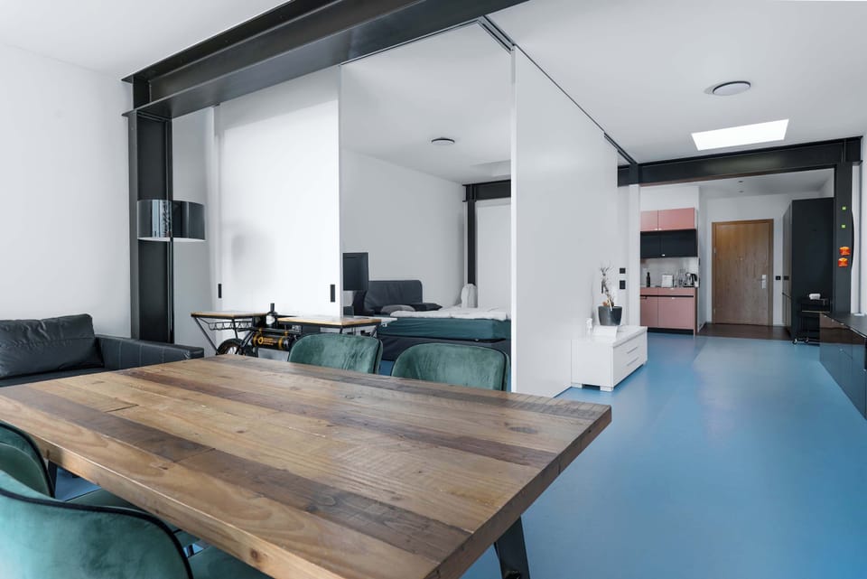 Open-plan living and dining area with contemporary furnishings.

