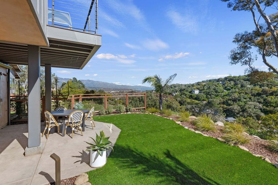 Two outdoor areas to enjoy, the upper deck connected to the main living area and lower patio with outside dining and grassy area.