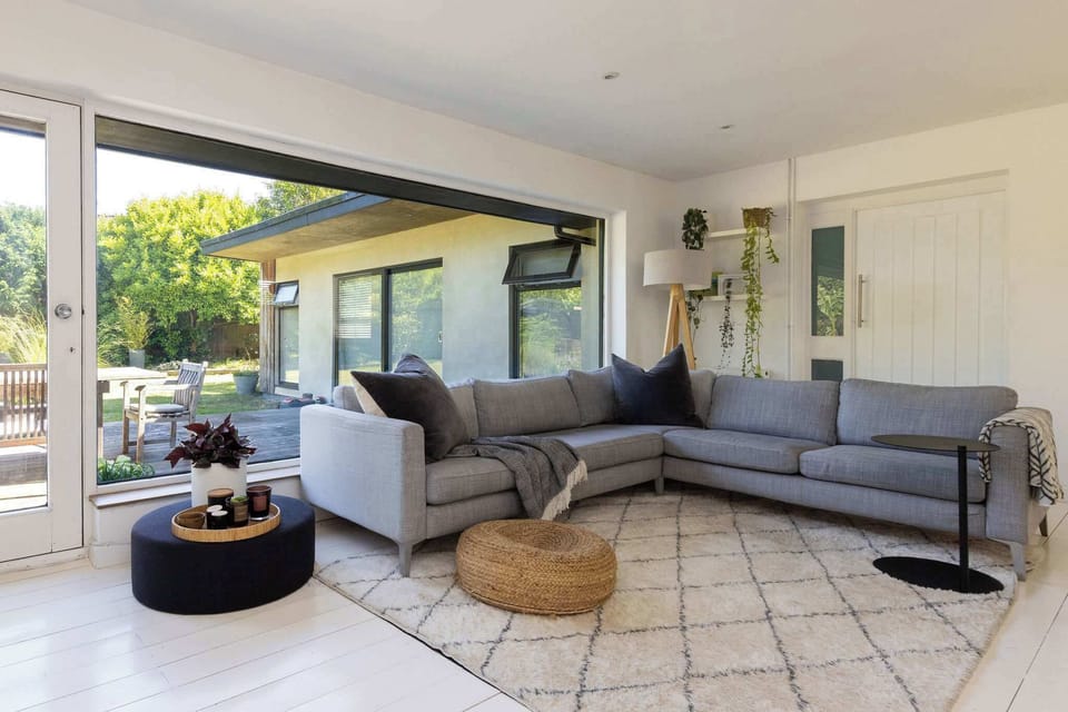 Sink into the sofa and enjoy garden views from the lounge