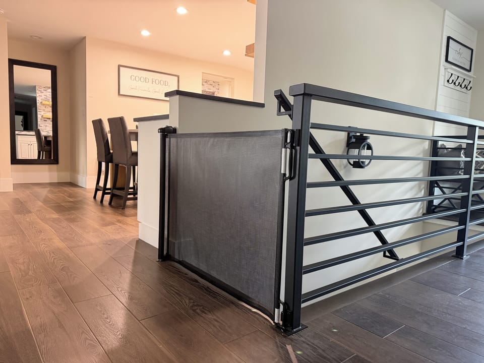 Modern loft landing with stylish railing and family-friendly stair gate
