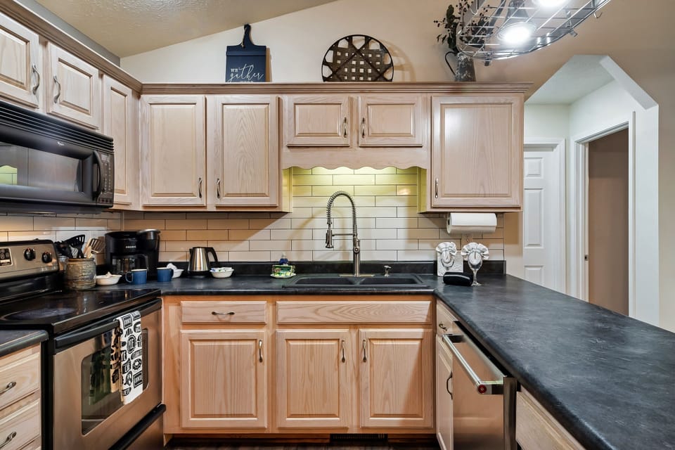 Kitchen fully-equipped for meals, snacks, and family gatherings